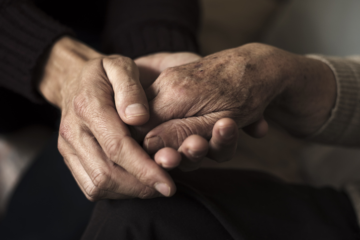 image of young and old holding hands